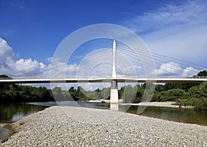 cable-stayed cycle-pedestrian bridge, on the Serchio river; taken from a river island