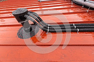 Cable tray outside with telecommunications cables, optic fiber, power cables and transmitter data cables from antennas