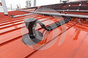 Cable tray outside with telecommunications cables, optic fiber, power cables and transmitter data cables from antennas
