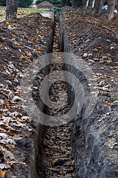 Cable trench in the ground, construction site