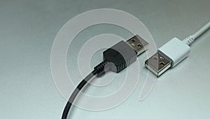 Cable USB connector, Electronic component to connection, Two USB port black and white color on grey background, Close up.