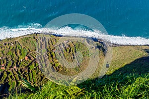 Cable way on Madeira view of a beautiful bright light. The ground station and the gondola on the way down. Portugal