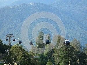 Cable way in mountains. Sunny summer day.