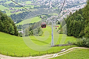 Cable-way to a mountain hoovering over a road way