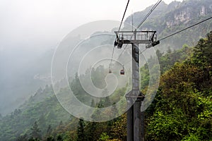 Cable way vanishing in mist or fog in Tianmen Mountain