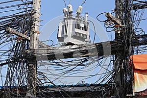 Cable wires on the electric poles are tangled,Messy signal line