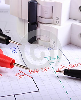 Cables of multimeter pen and electric fuse on electrical drawing