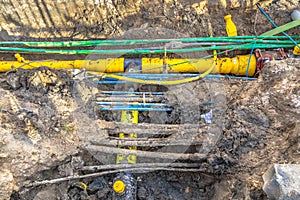 cables, pipes and sewage under pedestrian walkway