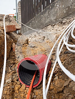 Cables sticking out of the safety tube in the street