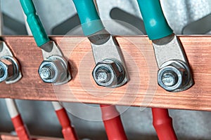 Cables or wires are connected to the electrical busbar by means of cable lugs.