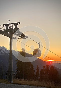 Cableway Gondola In The Mountains at sunset