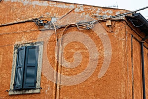 Cabling on colorful mediterranean house facade