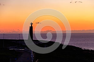Cabo da Roca cross monument at sunset photo