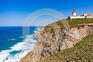 Cabo da Roca, Portugal. Lighthouse and cliffs over Atlantic Ocean photo