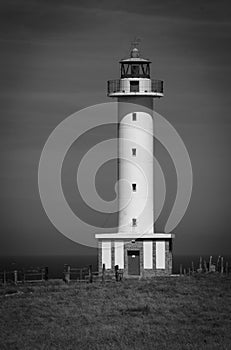 Cabo de Lastres lighthouse in Luces-Colunga, in Asturias. Spain. Black and white photo photo