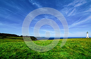 Cabo de Lastres lighthouse in Luces-Colunga, in Asturias (Spain),surrounded by green meadows