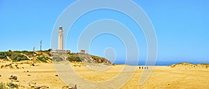 The Cabo de Trafalgar Cape Natural Park with the famous Lighthouse in the background. Barbate, Spain photo