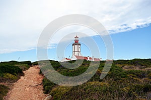 Cabo Espichel farol. Especial Cape lighthouse. Portugal. Landscape. Shipping. Help. Sky. Colorful background. Blue red green white photo