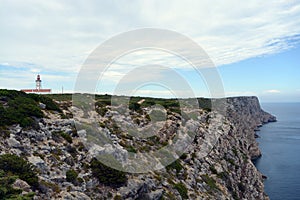 Cabo Espichel farol. Especial Cape lighthouse. Portugal. Landscape. Shipping. Help. Sky. Colorful background. Blue red green white photo