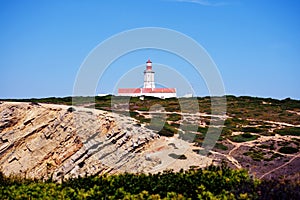 Cabo Espichel farol. Especial Cape lighthouse. Portugal. Landscape. Shipping. Help. Sky. Colorful background. Blue red green white photo