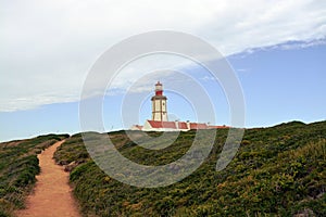 Cabo Espichel farol. Especial Cape lighthouse. Portugal. Landscape. Shipping. Help. Sky. Colorful background. Blue red green white photo