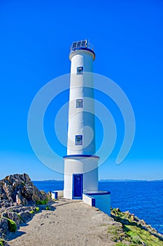 Cabo Home, Lighthouse at Cabo Home, an iconic cape in Cangas, In Landscape. Cabo Home, Cangas, Galicia, Spain photo