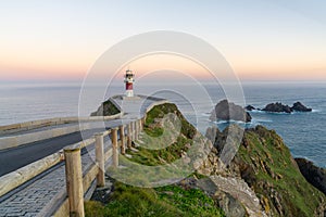 Cabo Ortegal lighthouse on the coast of Galicia at sunrise photo