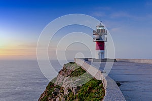 Cabo Ortegal lighthouse on the coast of Galicia at sunset