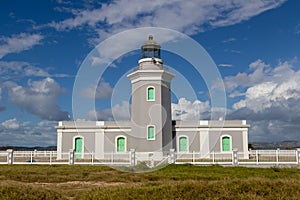 Cabo Rojo Lighthouse or Faro Los Morrillos de Cabo Rojo against the blue sky in Puerto Rico
