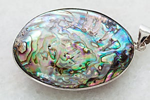 cabochon from Abalone (haliotis) shell on white