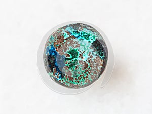 cabochon from Chrysocolla gemstone on white