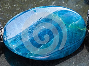 Cabochon from Kyanite gemstone on dark