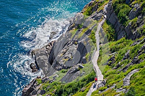 Cabot Trail with hikers staying in shape, walking along in St John's, Newfoundland.