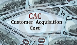 CAC - acronym on the background of cash dollar bills