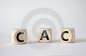 CAC - Customer Acquisition Cost symbol. Wooden cubes with word CAC. Beautiful white background. Business and Customer Acquisition