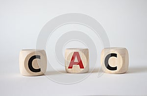 CAC - Customer Acquisition Cost symbol. Wooden cubes with word CAC. Beautiful white background. Business and Customer Acquisition