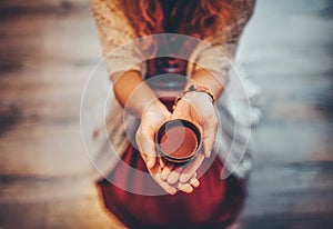 Cacao ceremony, heart opening medicine. Ceremony space. Cacao cup in woman& x27;s hand.