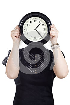 Cacasian woman holding wall clock