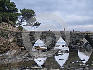 CadaquÃ©s Pitxot Bridge, access to a small islet off the coast photo