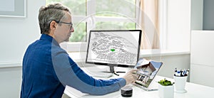 Cadastral Survey Map On Office Computer photo