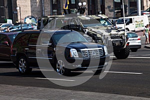 Cadillac Escalade rides around town