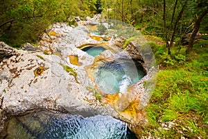 Cadini of Brenton, Sospirolo, Italy with azure clear water and m