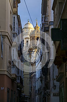 Cadiz Cathedral Tower Sunlit between NArrow Streets Andalusia