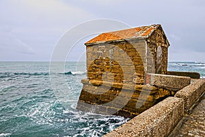 Cadiz seascape in Spain. Road to Castle of San Sebastian. photo