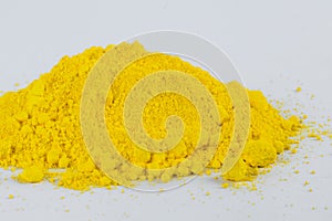 Cadmium Yellow pigment on a white background