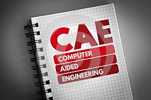 CAE - Computer Aided Engineering acronym on notepad, technology concept background photo