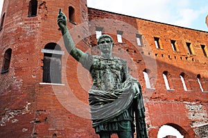 Caesar Augustus bronze statue in front of Palatine Gate in Turin, Italy