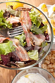 Caesar salad with bacon and eggs