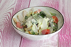 Caesar salad with chicken. Caesar salad on a white background