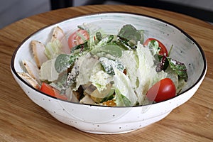 Caesar salad with chicken. Caesar salad on a white background